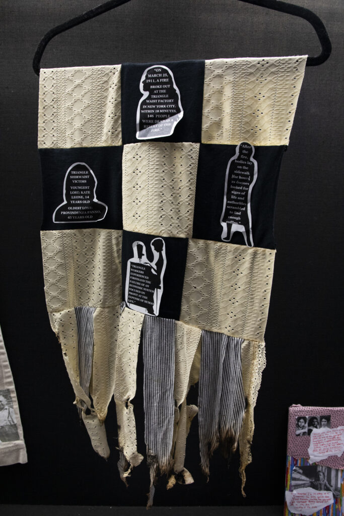 quilt with quotes in representation of the Triangle Shirtwaist Factory and the Rana Plaza Fire