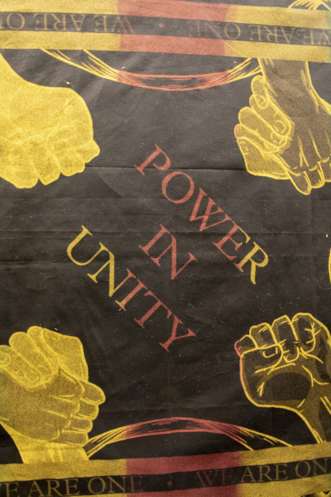 textile with "Power in Unity"